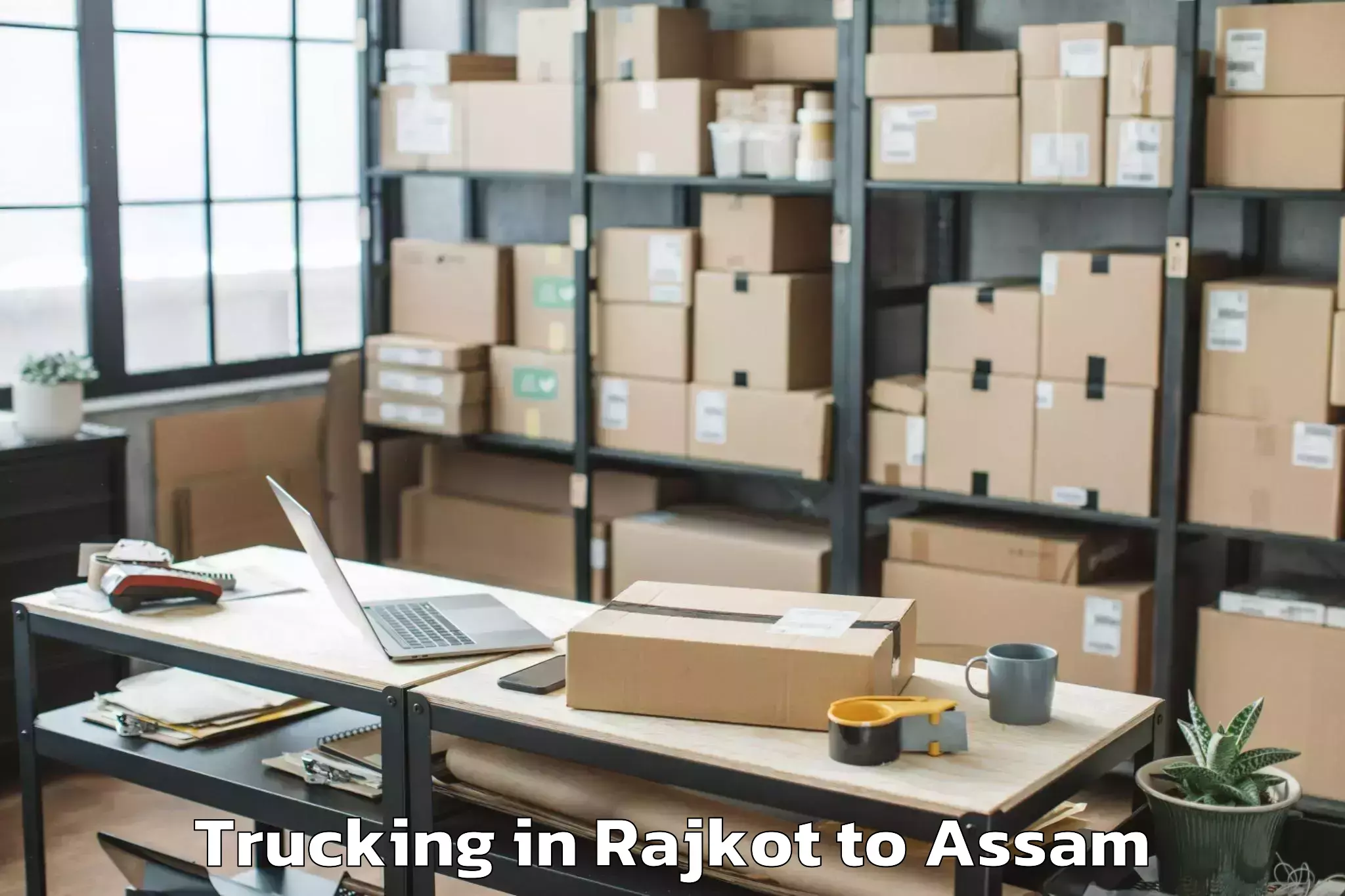 Book Rajkot to Baihata Trucking Online